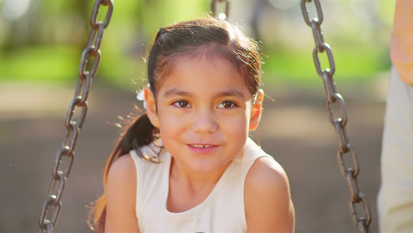 Adorable Little Girl Swings On Her Belly. Medium Shot. Stock Footage ...