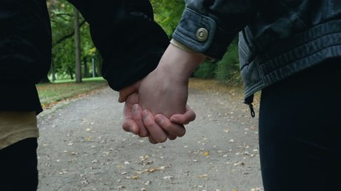 girlfriend and boyfriend holding hands