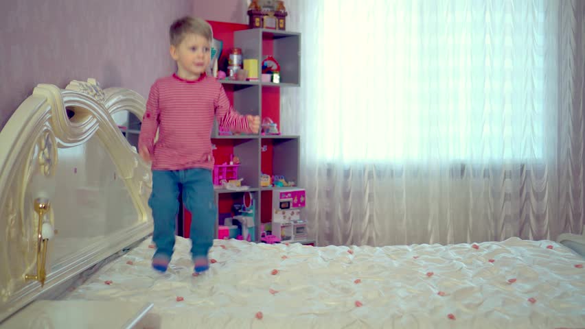 Little Boy Jumping On Bed Stock Footage Video (100% Royalty-free