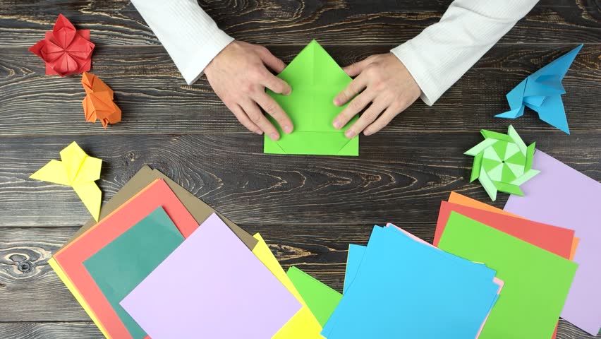 Man Folding Origami From Green Stock Footage Video 100 Royalty Free 1010409152 Shutterstock