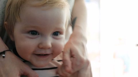 Portrait Of A Little Baby With Blond Hair And Blue Eyes Stock