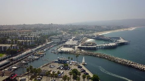 Redondo Beach California pier, shopping area and harbor with jetty from an aerial perspective