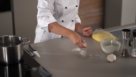 4K cooking footage, woman working with chilled dough in kitchen preparing for cooking gnocchi