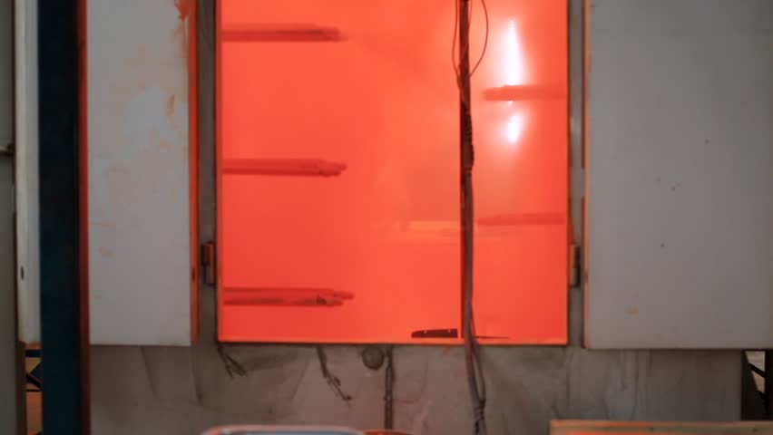 Painting Profiles At The Factory Stock Footage Video 100 Royalty Painting Profiles At The Factory In Orange Paint Conveyor Paints Metal Profile Hang On And Go To