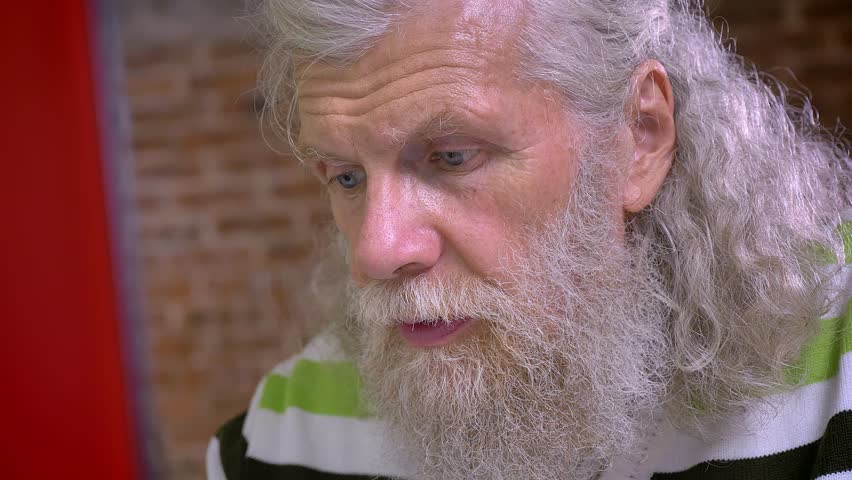 4k00 41close Up Photo Of Old Man With White Hair Looking Focused At
