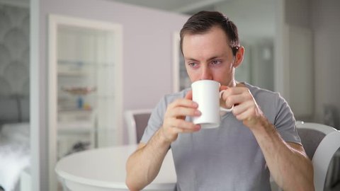 Home drinking. A man drinking Tea. Чай мужчина офис. Man with Tea. Man Drink Tea.