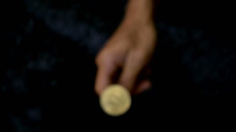 Slowmotion Shot Tossing Bitcoin To Flip On Heads Or Tails - 