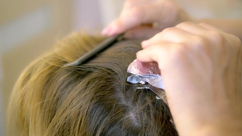 A Hairdressers Hand In Blue Stock Footage Video 100 Royalty Free