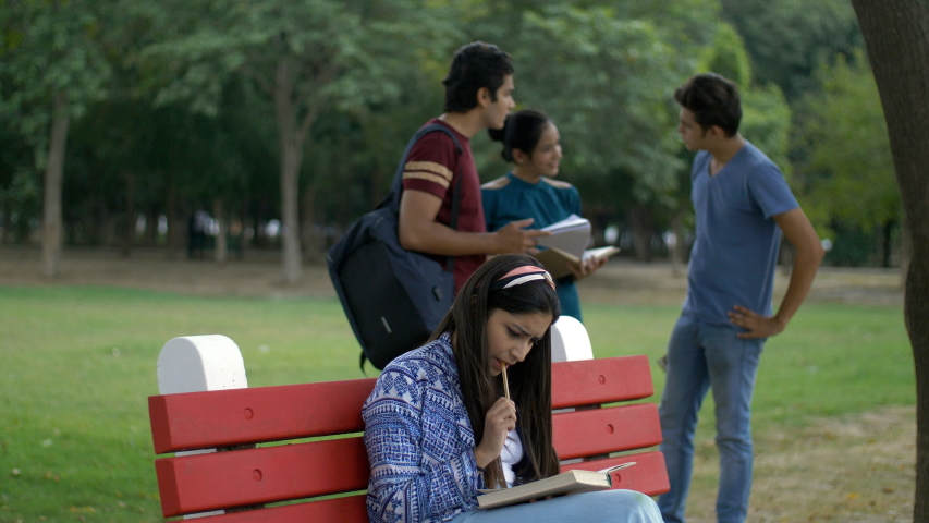 four-young-people-sitting-on-bench-image-free-stock-photo-public