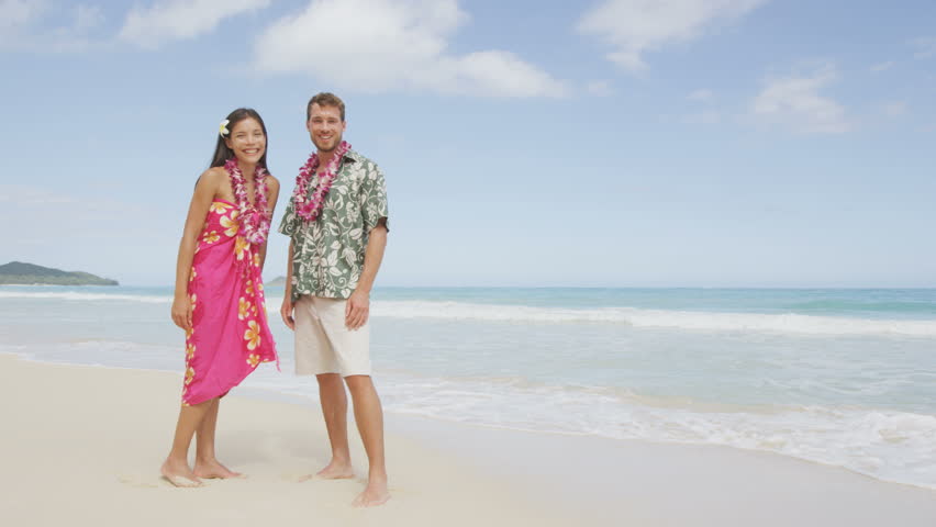 Happy Couple On Hawaii Vacation Walking On Beach With Hawaiian Leis And ...