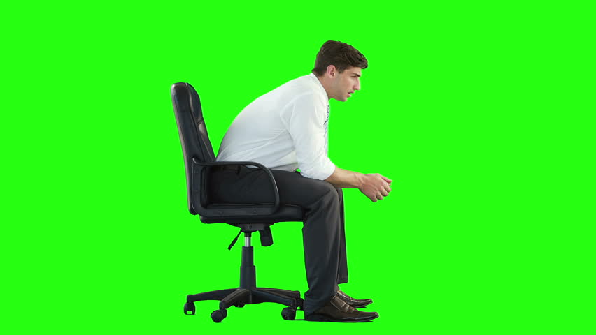 Handsome Young Businessman Sits On The Armchair & Takes Out Document ...