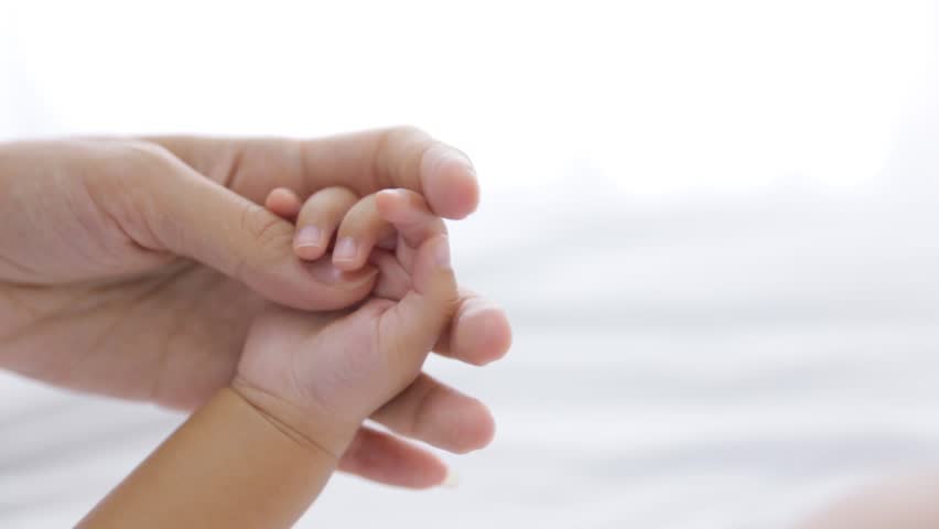 Download Parent Holding Newborns Hand. Hand In Hand. Mother And Her ...