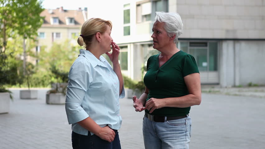 Two Older Women Meeting And Greeting In The City Two Older Women Meeting And Greeting In The City