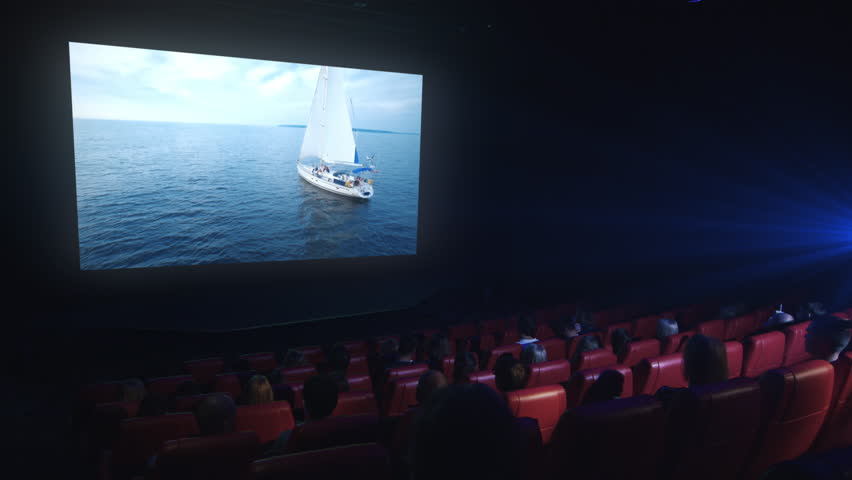 Group Of People Are Watching A Green Screen Mock-up Film Screening In A ...