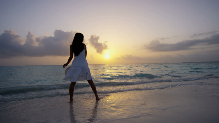Girl in a white dress walking on the beach images Girl in a white dress walking on the beach images