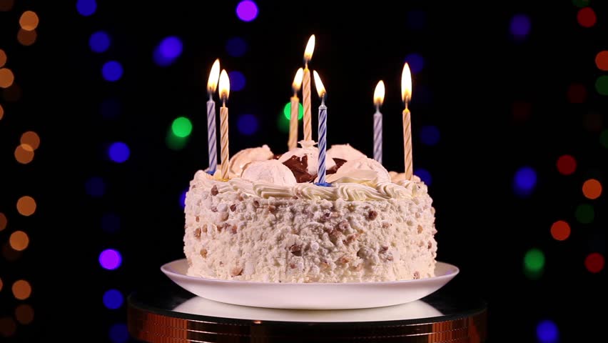Happy Birthday Cake With Burning Candles In Front Of Black Happy Birthday Cake With Burning Candles In Front Of Black