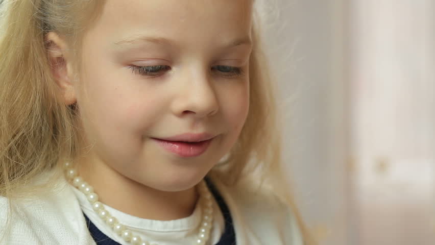 Beautiful Cute Nice Little Happy Small Girl Child Blonde Close Up Face Of The Little Girl Which Paints A Picture With Brush