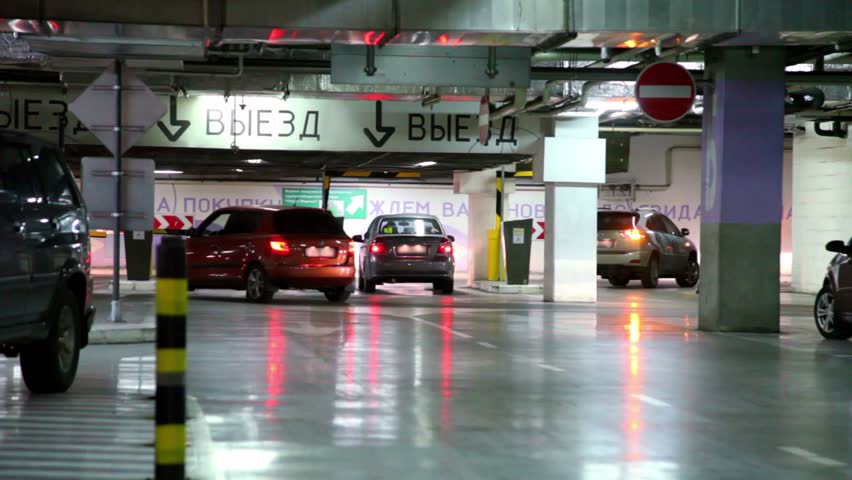 Hd00 10several Cars Ride Away From Underground Parking Garage