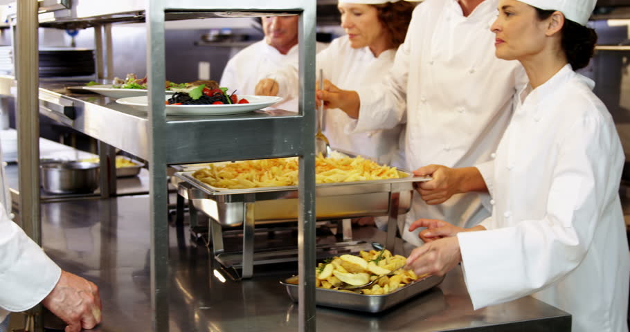 Restaurant Kitchen Video group of chefs giving plates on order line in a restaurant kitchen Restaurant Kitchen Video group of chefs giving plates on order line in a restaurant kitchen