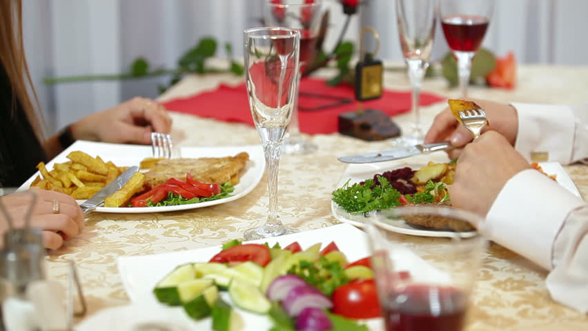 Dining Table With Food panning shot of place setting at wedding reception. food and Dining Table With Food panning shot of place setting at wedding reception. food and