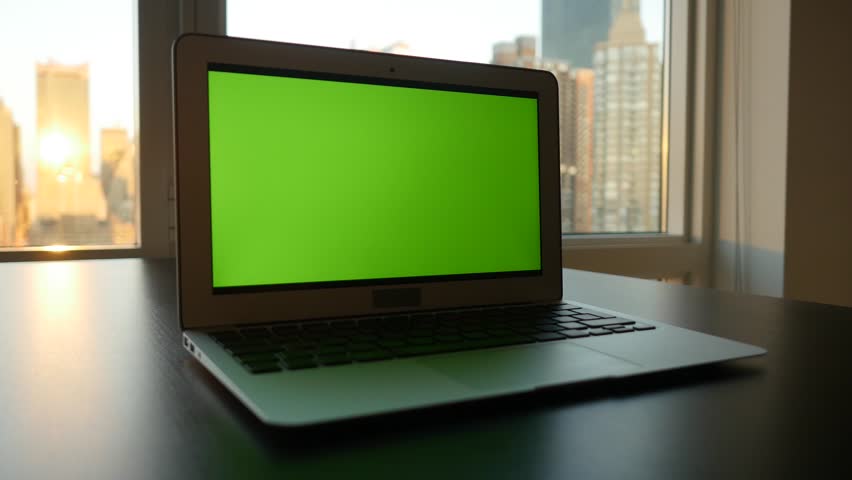 Laptop Computer With Isolated Green Screen Background. Modern City ...