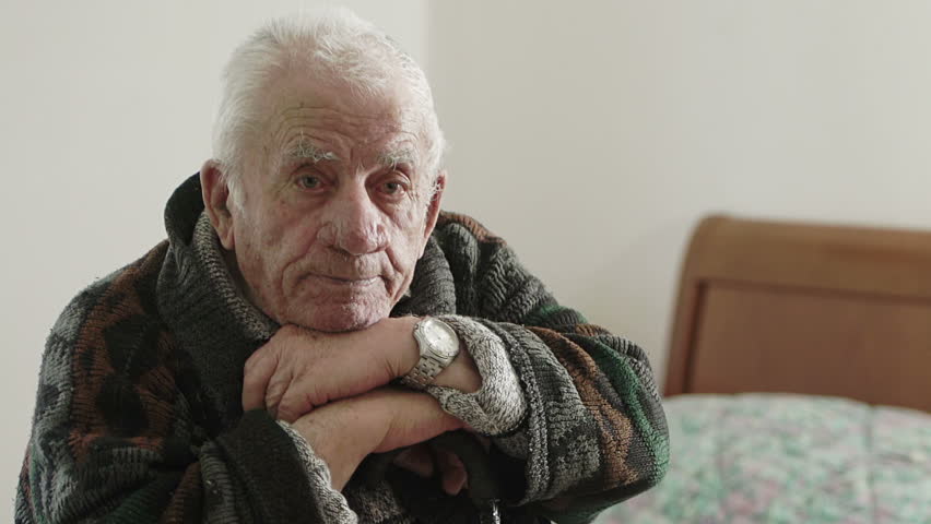 Elderly Woman Sings/says Sitting At The Table Near The Window. Stock ...