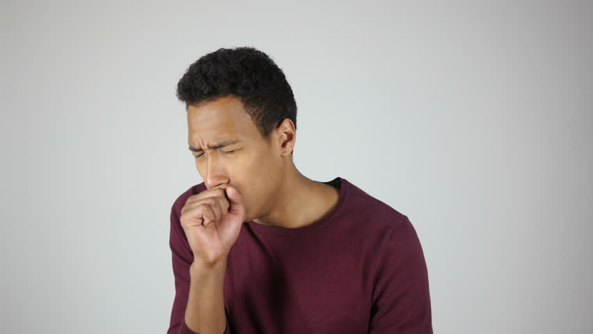 Attractive Young Man Smoking Cigarette And Coughing In Studio Shoot On ...