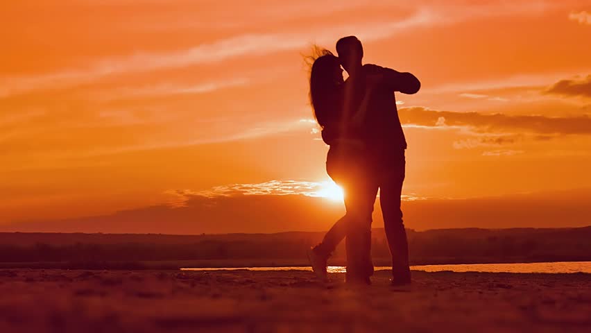 Couple dancing a slow dance in sunset sun silhouettes, Valentine's Day ...