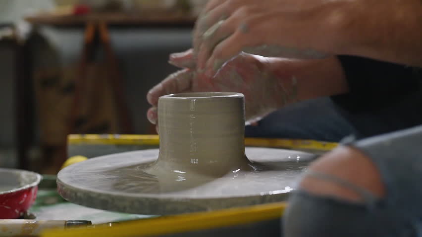 Potter, Craftsman Is Working On Pottery Wheel, Moulding A Clay Pot ...