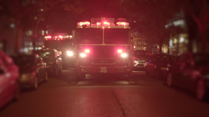 Fire Truck Emergency Vehicle Blue Lights Flashing Fireman Working Fire Department Trucks With Flashing Siren Lights Standing In The City Streets At Night Rescue