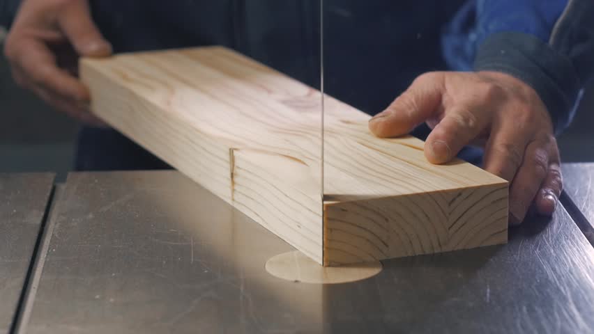 Modern Furniture Video man using a table saw to cut wood, grinding on modern furniture Modern Furniture Video man using a table saw to cut wood, grinding on modern furniture