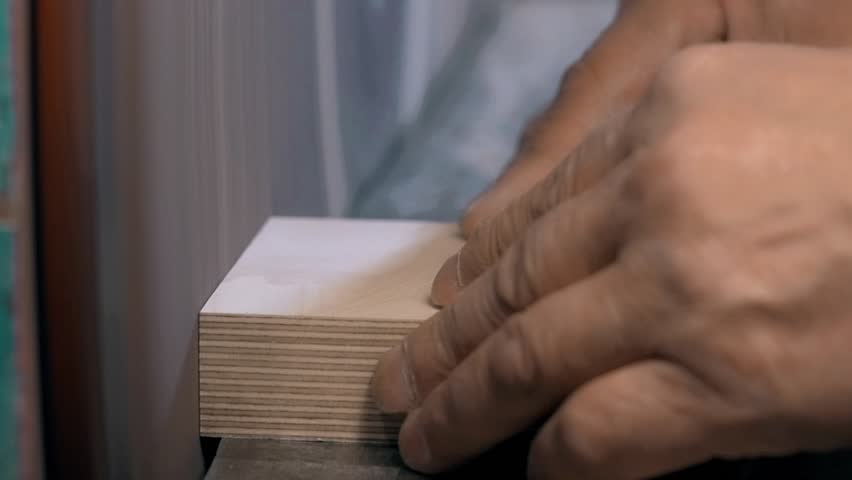 Modern Furniture Video man using a table saw to cut wood, grinding on modern furniture Modern Furniture Video man using a table saw to cut wood, grinding on modern furniture