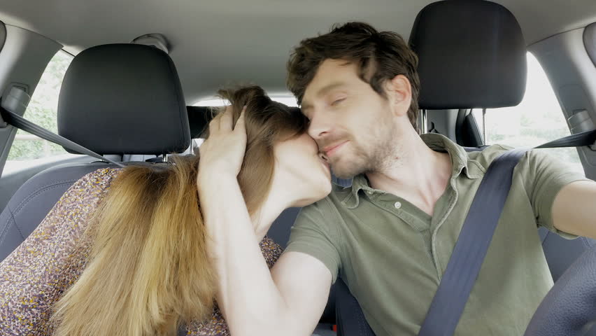 Happy Couple Laughing And Cuddling In Car Driving Stock Footage Video ...