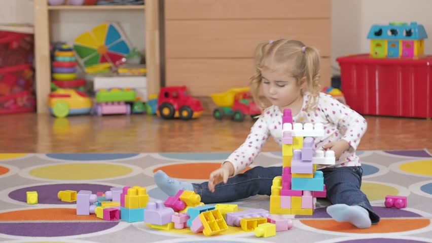 little girls playing with toys