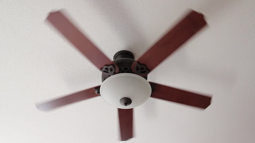 Ceiling Fan Stock Footage Video Shutterstock A Ceiling Fan Slowly Spins On Low Setting