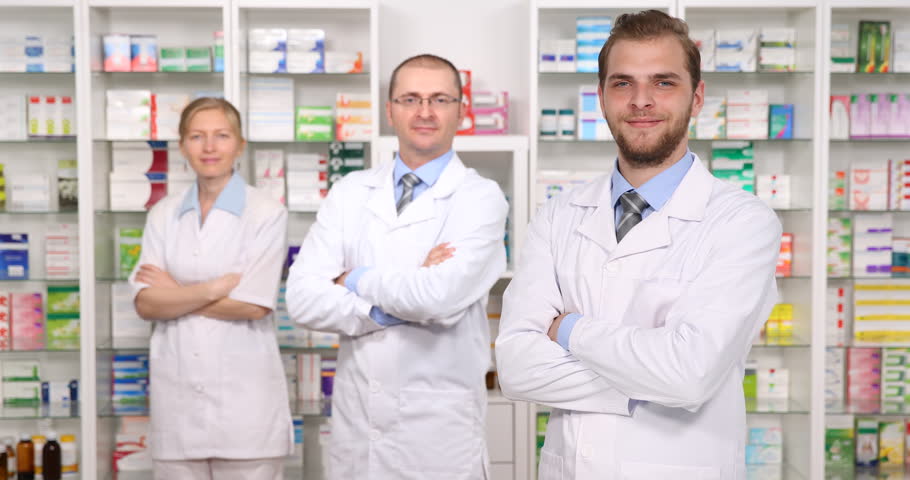 Female Pharmacist Holding A Drug Box While Smiling In Hospital Ward ...