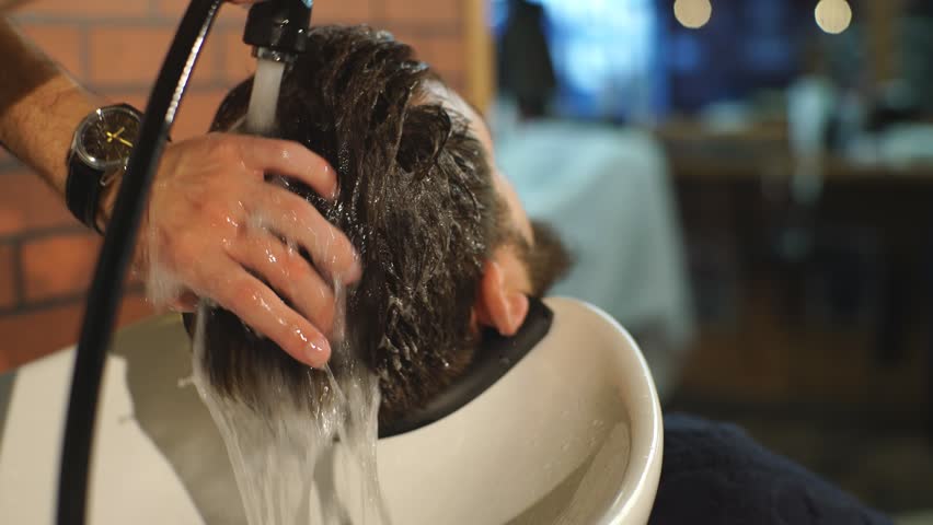 Hairstylist Washing Clients Hair In Stock Footage Video 100