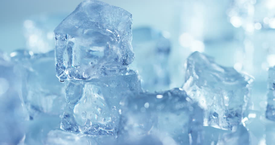 Macro Shot Of Pure Water Ice Cubes That Melt In Slow Motion On White ...