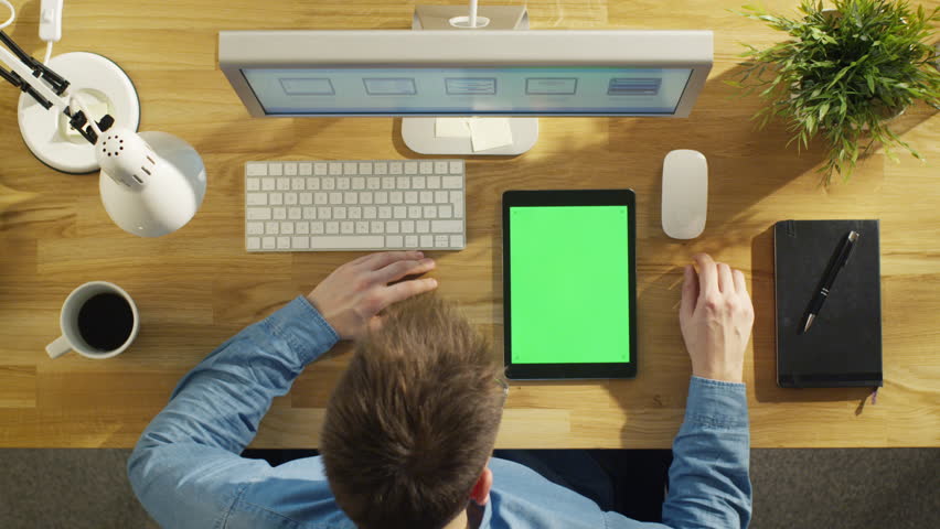 Top View Of Young Creative Designer Looking At Tablet Computer ...