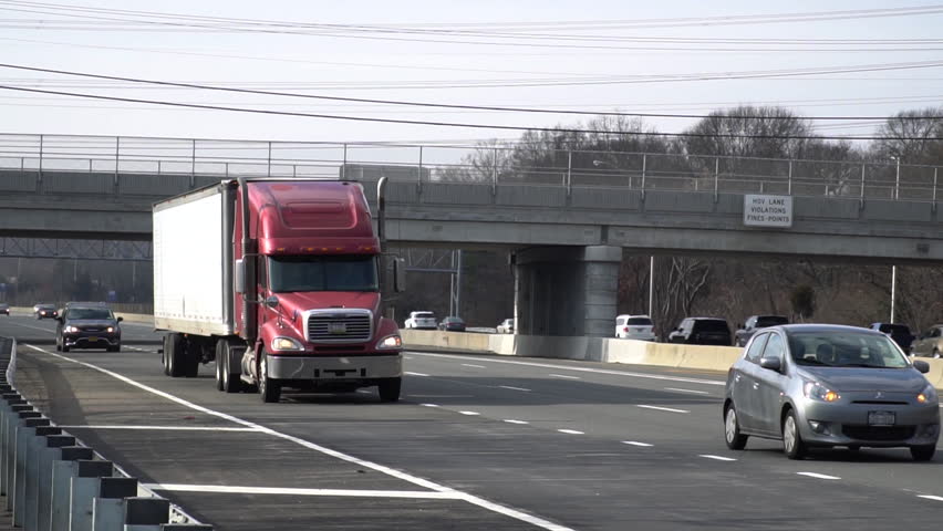 Large Semi Tractor Trailer Stock Footage Video 100 Royalty Large Semi Tractor Trailer Rig Traveling On Long Island Expressway In Slow Motion Towards New York City Cargo Container Vehicle Transport Materials