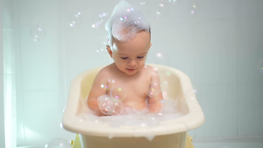 Two Year Old Boy Plays In The Bath Slow Motion Stock Footage Slow Motion Footage Of Cute Baby Boy Playing In Bathtub With Suds And Soap Bubbles