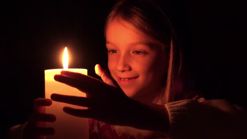 A Woman Sitting Alone At A Table With Candles Drinking A Glass Of Wine ...