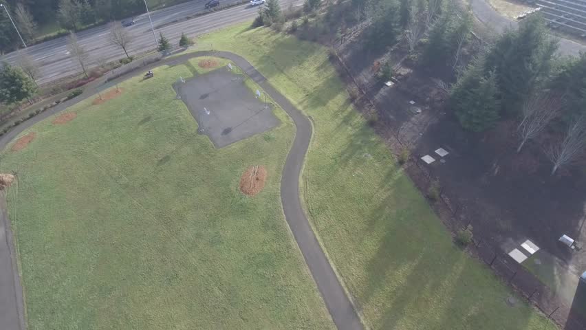 Laying Paving Slabs By Mosaic Close Up Road Construction Orbit Shot Of Outdoor Park Playground Basketball Court With Green Grass 4k Stock Footage Clip