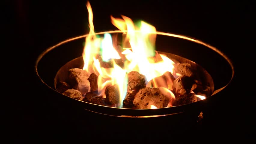 Colorful Flames In Propane Fire Pit While Camping