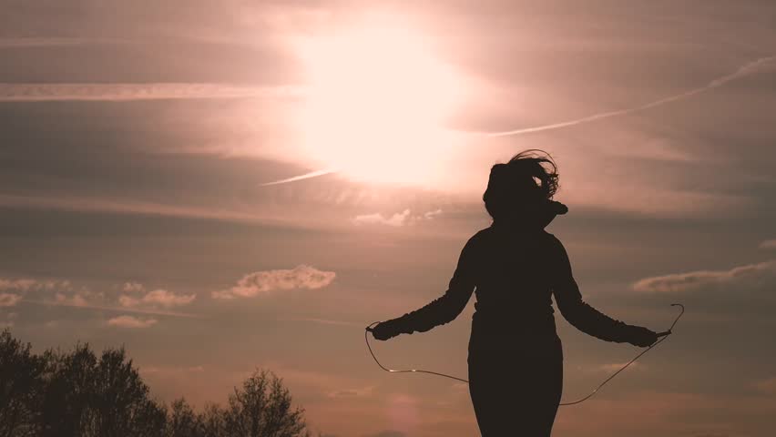 Stock video of silhouette of a girl jumping rope | 25517132 | Shutterstock