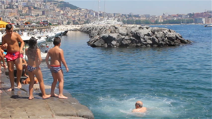 Naples Italy July 2017 Stock Footage Video 100 Royalty Free Naples Italy July 2017 Italian Children Jumping Into The Water From Pier On Background Of