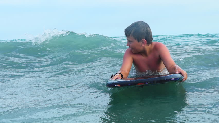 Kid On Boogie Board Having Stock Footage Video 100 Royalty Free 26387342 Shutterstock