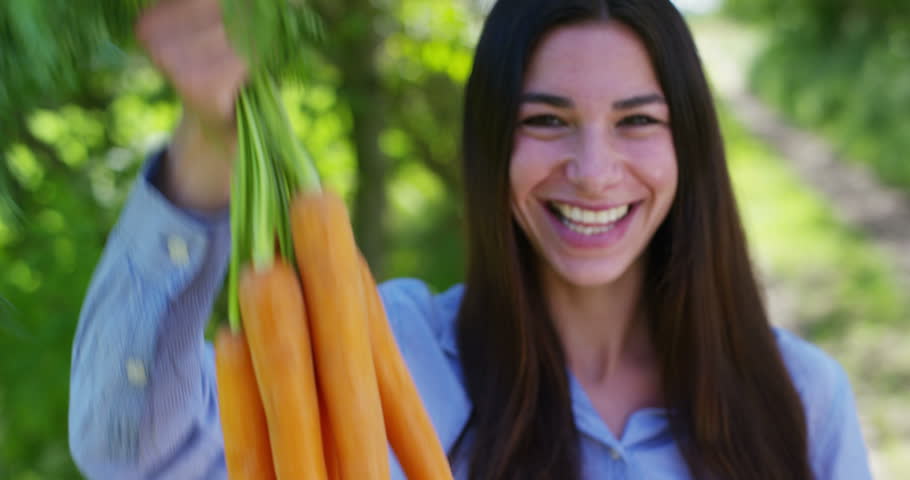 Young And Beautiful Vegetarian Girl In Orange Garden. Indonesia. Bali ...