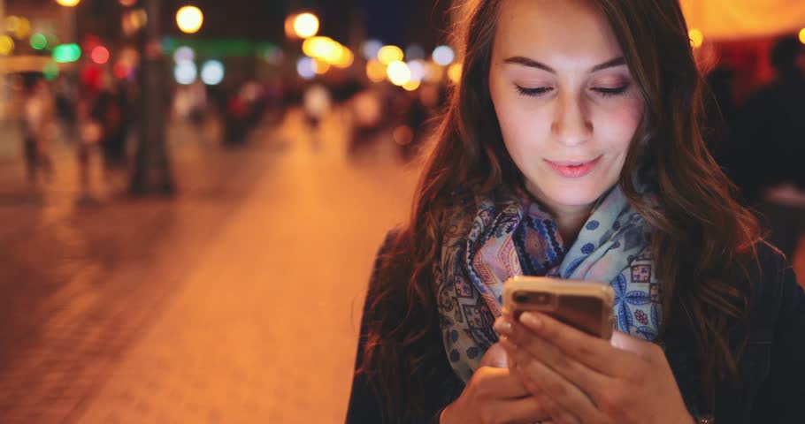 Woman Using Smart Phone At Night In City. 4K. Attractive Young Woman ...