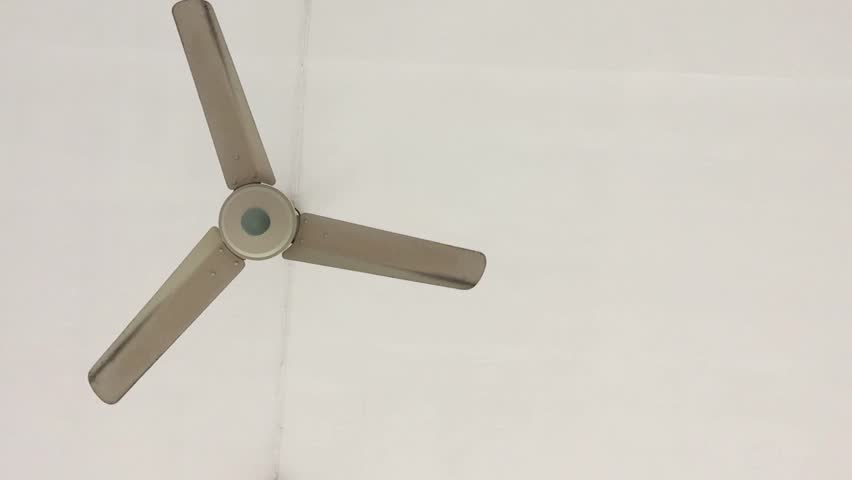 Ceiling Fan Spinning Slowly And Gradually Coming To A Stop White The Ceiling Fan Gradually Rotates Rotor Because Of Wind Force Hd Stock